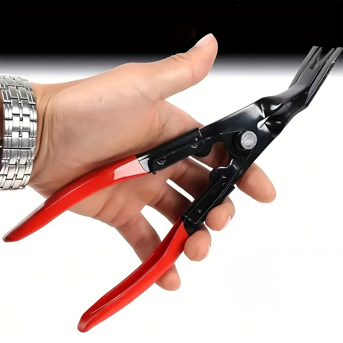 Clip removal pliers held in hand