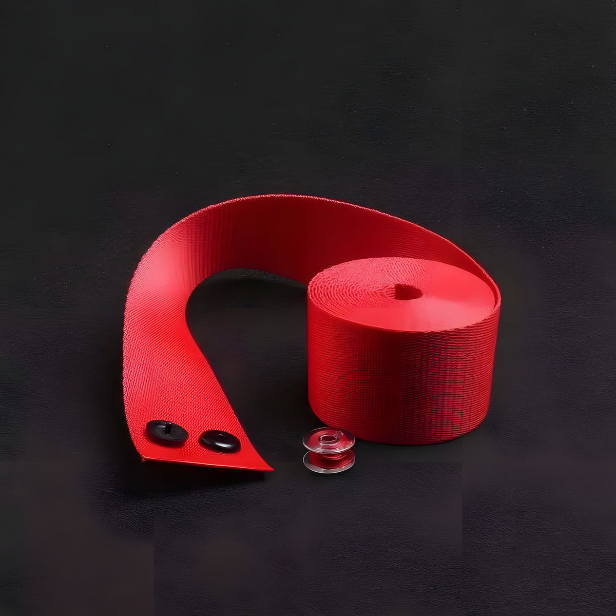 Red seat belt webbing with stopper buttons and matching thread