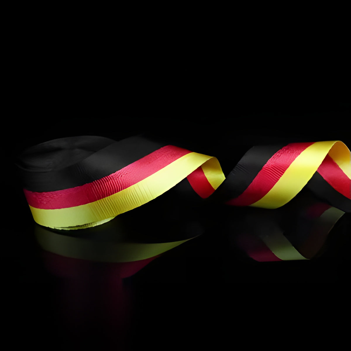 Black, red and yellow striped seat belt webbing