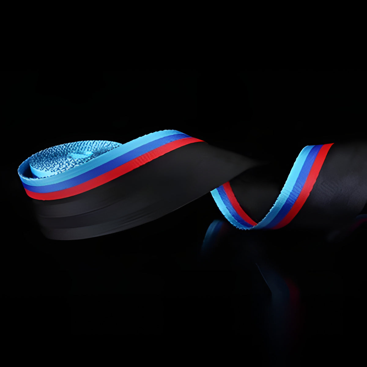 Black seat belt webbing with a blue and red stripe