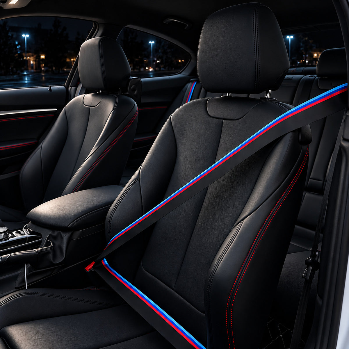 Black seat belt webbing with a blue and red stripe fitted to a car seat