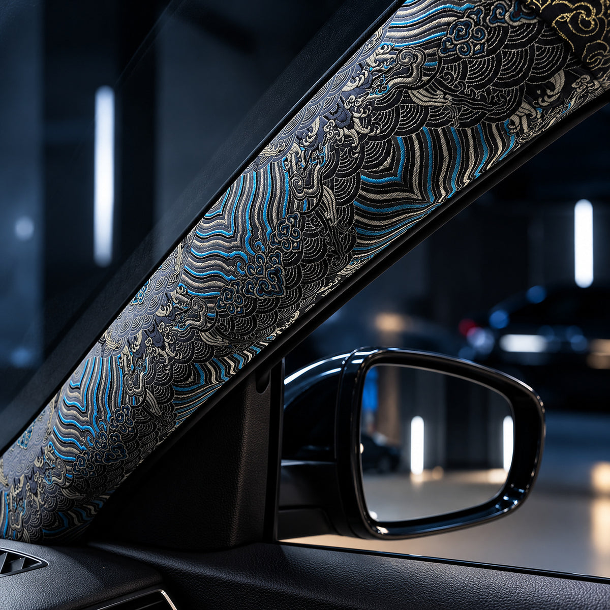 Blue embroidered pillar wrap fitted to a car A-pillar