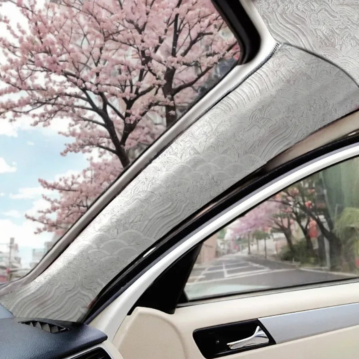 White embroidered wrap fitted to a car A-pillar