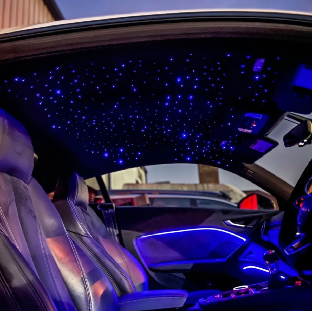 Starlight headliner at night inside an SUV