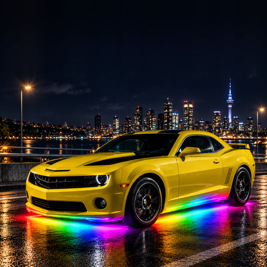 Underglow kit lit up in rainbow colours under a car